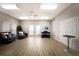 Well-lit common room with neutral walls, comfortable seating, and laminate flooring at 5712 Garden Lakes Dr, Bradenton, FL 34203