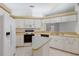Bright kitchen featuring white appliances and ample counter space for meal preparation at 5712 Garden Lakes Dr, Bradenton, FL 34203
