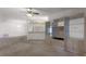 Open-concept living room with unique built-in shelving and cabinetry, and neutral carpet at 5712 Garden Lakes Dr, Bradenton, FL 34203