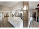 Community serving area with white cabinetry, white countertops, and hardwood floors at 5712 Garden Lakes Dr, Bradenton, FL 34203