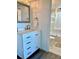 Clean bathroom with white vanity, contrasting hardware, and a view of the shower/tub combo at 5855 Midnight Pass Rd # 621, Sarasota, FL 34242