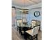 Dining area featuring modern lighting, a glass-top table, and stylish decor at 5855 Midnight Pass Rd # 621, Sarasota, FL 34242