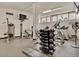 Community gym with weight machines, treadmills, TV, and ceiling fan offering a complete workout center at 5855 Midnight Pass Rd # 621, Sarasota, FL 34242