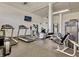 Community gym featuring stationary bike, weight machines, ceiling fan, and wall mounted TV at 5855 Midnight Pass Rd # 621, Sarasota, FL 34242
