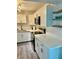 Bright kitchen with stainless steel appliances, white cabinetry, and sleek countertops at 5855 Midnight Pass Rd # 621, Sarasota, FL 34242