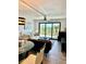 Bright living room with modern decor, large windows, and scenic views overlooking lush greenery at 5855 Midnight Pass Rd # 621, Sarasota, FL 34242