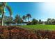 Picturesque community featuring a lake, fountain, lush landscaping, and a gazebo for outdoor enjoyment at 5877 Ferrara Dr, Sarasota, FL 34238