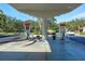 A community gas station with dual pumps, a bright canopy and meticulous landscaping at 5877 Ferrara Dr, Sarasota, FL 34238