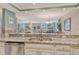 Kitchen with stainless steel appliances, granite countertops, and open sightlines to the living room at 5916 Midnight Pass Rd # 404, Sarasota, FL 34242