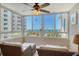 Relaxing lanai with seating and stunning views of the ocean, pool, and surrounding landscape, perfect for leisure at 5916 Midnight Pass Rd # 404, Sarasota, FL 34242