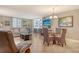 Comfortable living room with neutral tones, tiled floors, modern furniture, and access to the lanai at 5916 Midnight Pass Rd # 404, Sarasota, FL 34242