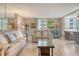 Cozy living area with comfortable sofas, tiled flooring, and elegant decor, creating a relaxing atmosphere at 5916 Midnight Pass Rd # 404, Sarasota, FL 34242
