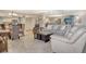Open-concept living space features a dining area, living room with comfortable seating, and a modern kitchen at 5916 Midnight Pass Rd # 404, Sarasota, FL 34242