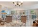 Charming living room with ample seating, natural light, and access to a sunroom overlooking the ocean at 5916 Midnight Pass Rd # 404, Sarasota, FL 34242