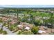 Panoramic aerial shot of a residential area with a golf course and lake in the background at 6207 Courtside Dr # 23, Bradenton, FL 34210