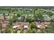 Scenic aerial view of residential area adjacent to a lush golf course and waterfront at 6207 Courtside Dr # 23, Bradenton, FL 34210