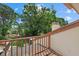 Balcony with a partial view of trees and plants at 6207 Courtside Dr # 23, Bradenton, FL 34210