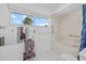 Neat bathroom with a window, bathtub, shower curtain, and a towel rack at 6207 Courtside Dr # 23, Bradenton, FL 34210