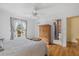 Bright bedroom with a comfortable bed, closet, and a glimpse of the bathroom at 6207 Courtside Dr # 23, Bradenton, FL 34210