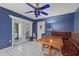 Eat-in kitchen featuring a built-in bench, french doors and white tile floors at 6207 Courtside Dr # 23, Bradenton, FL 34210