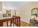 Second-floor hallway with hardwood floors, a wooden banister, and natural light at 6207 Courtside Dr # 23, Bradenton, FL 34210