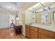 Hallway wet bar with decorative glasses and mirrored backsplash at 6207 Courtside Dr # 23, Bradenton, FL 34210