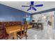 Eat-in kitchen with white cabinets, an island with bar seating, and a table with a built-in bench at 6207 Courtside Dr # 23, Bradenton, FL 34210