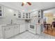 White kitchen with updated countertops, cabinetry, and stainless steel appliances at 6207 Courtside Dr # 23, Bradenton, FL 34210