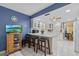 Kitchen with white cabinets, an island, granite countertops and stainless steel appliances at 6207 Courtside Dr # 23, Bradenton, FL 34210