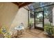 Charming outdoor patio with colorful table and chairs, perfect for enjoying the garden view at 6207 Courtside Dr # 23, Bradenton, FL 34210