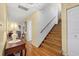 Open stairway with wood stairs and a railing leading to the second floor at 6207 Courtside Dr # 23, Bradenton, FL 34210