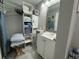 Practical bathroom boasts convenient storage, a large mirror, and essential amenities at 7150 N Tamiami Trl # S-623, Sarasota, FL 34243