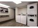 Clean laundry room area with two washers and dryers for tenant use at 7150 N Tamiami Trl # S-623, Sarasota, FL 34243