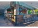 Vibrant outdoor bar area with TV screens and ample seating, perfect for enjoying drinks and social gatherings at 7150 N Tamiami Trl # S-623, Sarasota, FL 34243