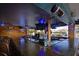 Stylish outdoor bar featuring a rustic wood design with comfortable seating and ambient blue lighting at 7150 N Tamiami Trl # S-623, Sarasota, FL 34243