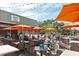 Inviting outdoor dining area with shaded seating and beautiful marina views for delightful outdoor experiences at 7150 N Tamiami Trl # S-623, Sarasota, FL 34243