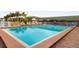 Inviting swimming pool surrounded by lounge chairs and lush landscaping, perfect for a relaxing day outdoors at 7150 N Tamiami Trl # S-623, Sarasota, FL 34243