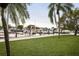 Scenic waterfront view, framed by palm trees, showcasing boats docked at the marina at 7150 N Tamiami Trl # S-623, Sarasota, FL 34243
