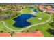 Aerial view of a lush green golf course community with ponds, sand traps, and walking paths at 7179 Boca Grove Pl # 202, Lakewood Ranch, FL 34202