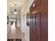 Entryway featuring tile floors, archways, and an open view into the home's living spaces at 7179 Boca Grove Pl # 202, Lakewood Ranch, FL 34202