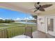 Inviting patio with a relaxing seating area, offering serene views of the golf course and lake at 7179 Boca Grove Pl # 202, Lakewood Ranch, FL 34202