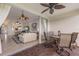 Indoor and outdoor living spaces merge through the sliding glass doors to the patio with a dining set at 7179 Boca Grove Pl # 202, Lakewood Ranch, FL 34202
