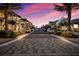 Inviting street view with palm trees, sidewalks, and charming architecture, ideal for a relaxing community lifestyle at 7179 Boca Grove Pl # 202, Lakewood Ranch, FL 34202