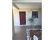 View of the front entryway featuring a plant and the front door at 7273 Cloister Dr # 121, Sarasota, FL 34231