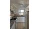 Bright kitchen with white cabinets and updated countertops at 7273 Cloister Dr # 121, Sarasota, FL 34231