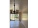 Bright living room with tile floors and sliding glass doors to the patio at 7273 Cloister Dr # 121, Sarasota, FL 34231