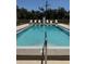 Outdoor pool with lounge chairs and clear blue water, perfect for relaxation and recreation at 7273 Cloister Dr # 121, Sarasota, FL 34231