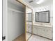 Bathroom with mirrored closet doors, a dual sink vanity, and ample lighting for a refreshing experience at 7500 40Th W Ave # 108, Bradenton, FL 34209