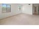 Bright bedroom with carpet flooring, two windows, and neutral walls for a clean and inviting space at 7500 40Th W Ave # 108, Bradenton, FL 34209