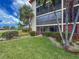 Building shows lanai, tropical landscaping, and lush greenery in a serene setting on a beautiful day at 7500 40Th W Ave # 108, Bradenton, FL 34209